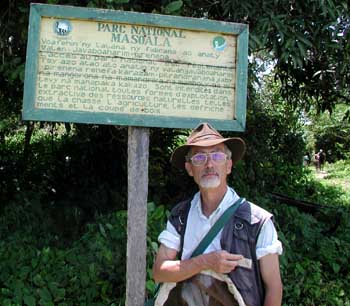 Gianfranco Curletti in front of the entrance sign of Masoala National Park, in Madagascar
